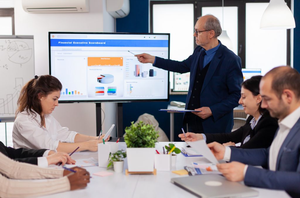 Business simulation data visualization explained through interactive dashboards and charts in corporate training.